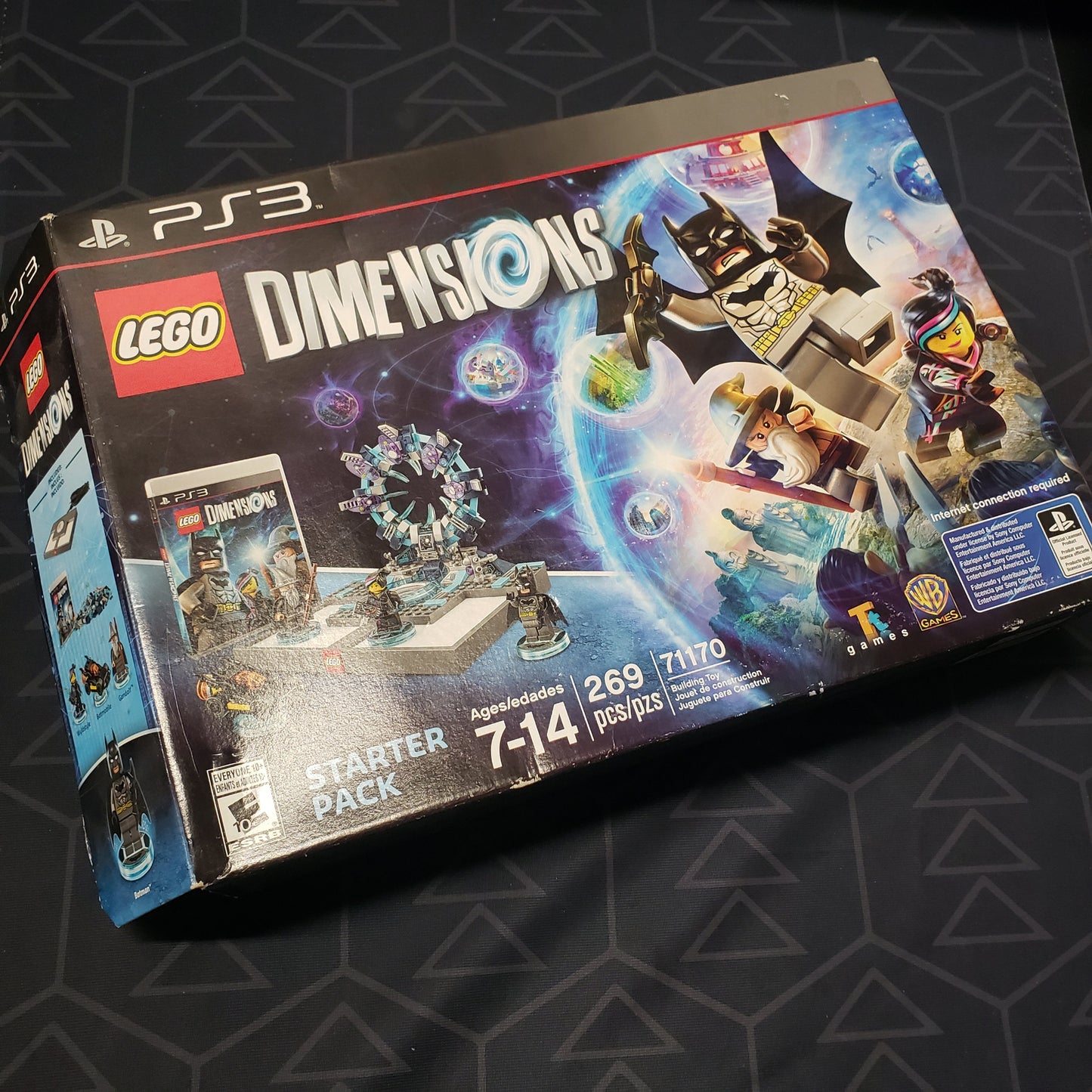 Image shows the front of the Starter Pack box for the video game LEGO Dimensions for Playstation 3