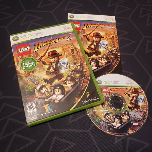 Image shows the case, manual and disc for the video game LEGO Indiana Jones 2: The Adventure Continues for Xbox 360