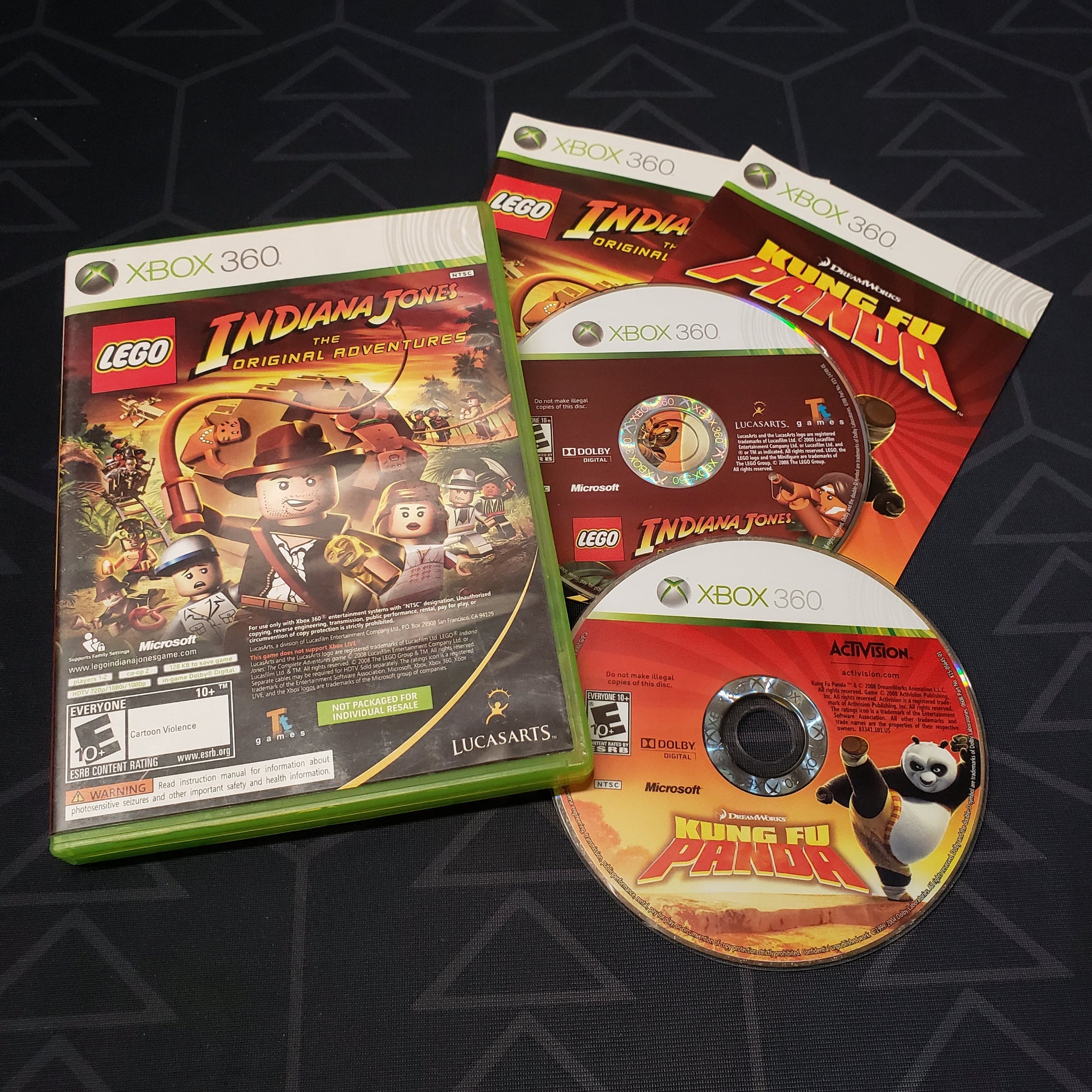 Image shows the case, manuals and two discs for the video game set LEGO Indiana Jones: The Original Adventures / Kung Fu Panda for Xbox 360
