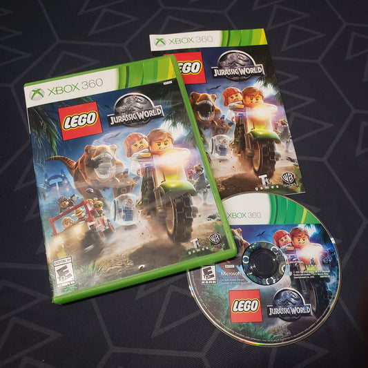 Image shows the case, manual and disc for the video game LEGO Jurassic World for Xbox 360