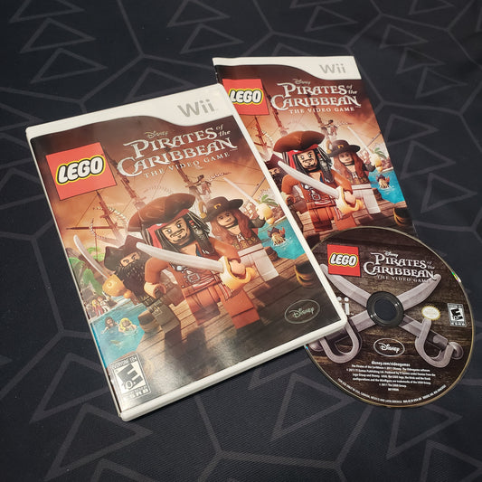 Image shows the case, manual and disc for the video game LEGO Pirates of the Caribbean for Nintendo Wii
