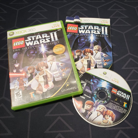 Image shows the case, manual and disc for the video game LEGO Star Wars II: The Original Trilogy for Xbox 360