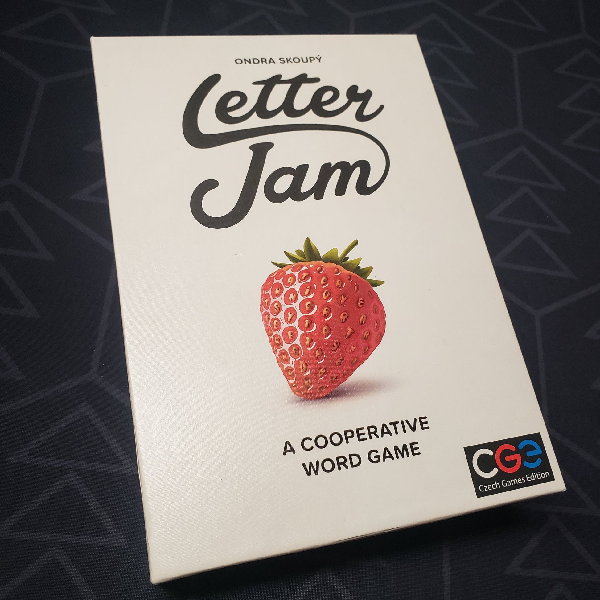 Image shows the front cover of the box for the Letter Jam board game