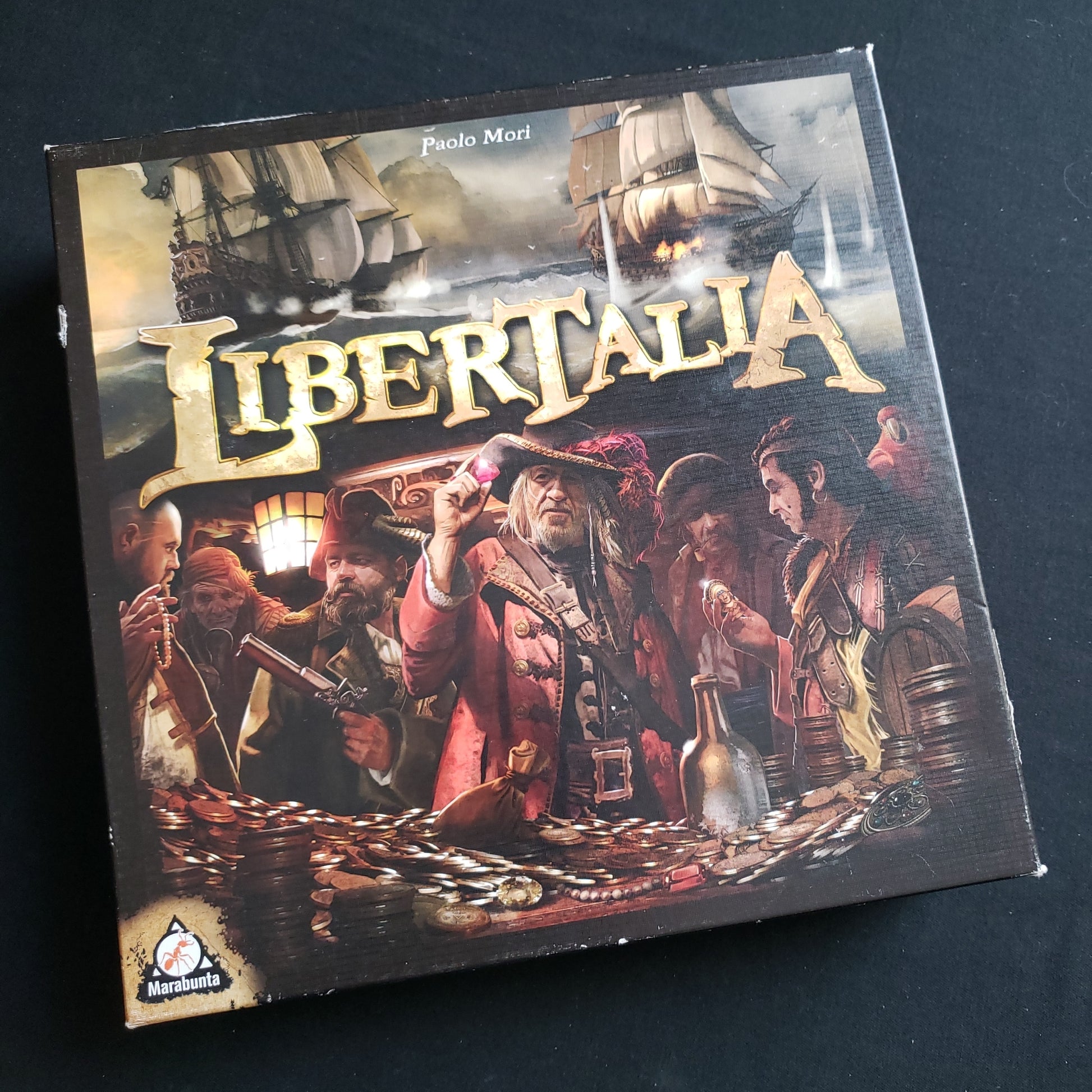 Image shows the front cover of the box of the Libertalia board game