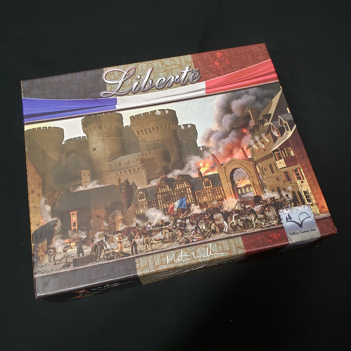 Image shows the front cover of the box of the Liberte board game