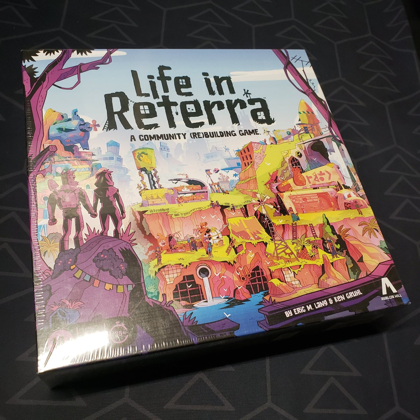 Image shows the front cover of the box for the Life in Reterra board game