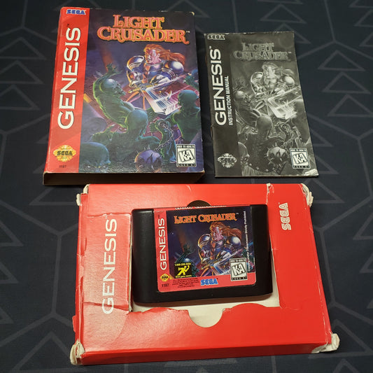 Image shows the outer & inner box, manual and cartridge for the video game Light Crusader for Sega Genesis