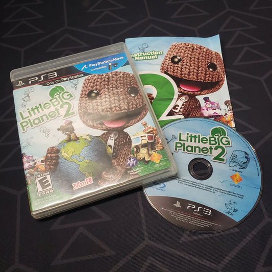 Image shows the case, manual and disc for the video game LittleBigPlanet 2 for Playstation 3