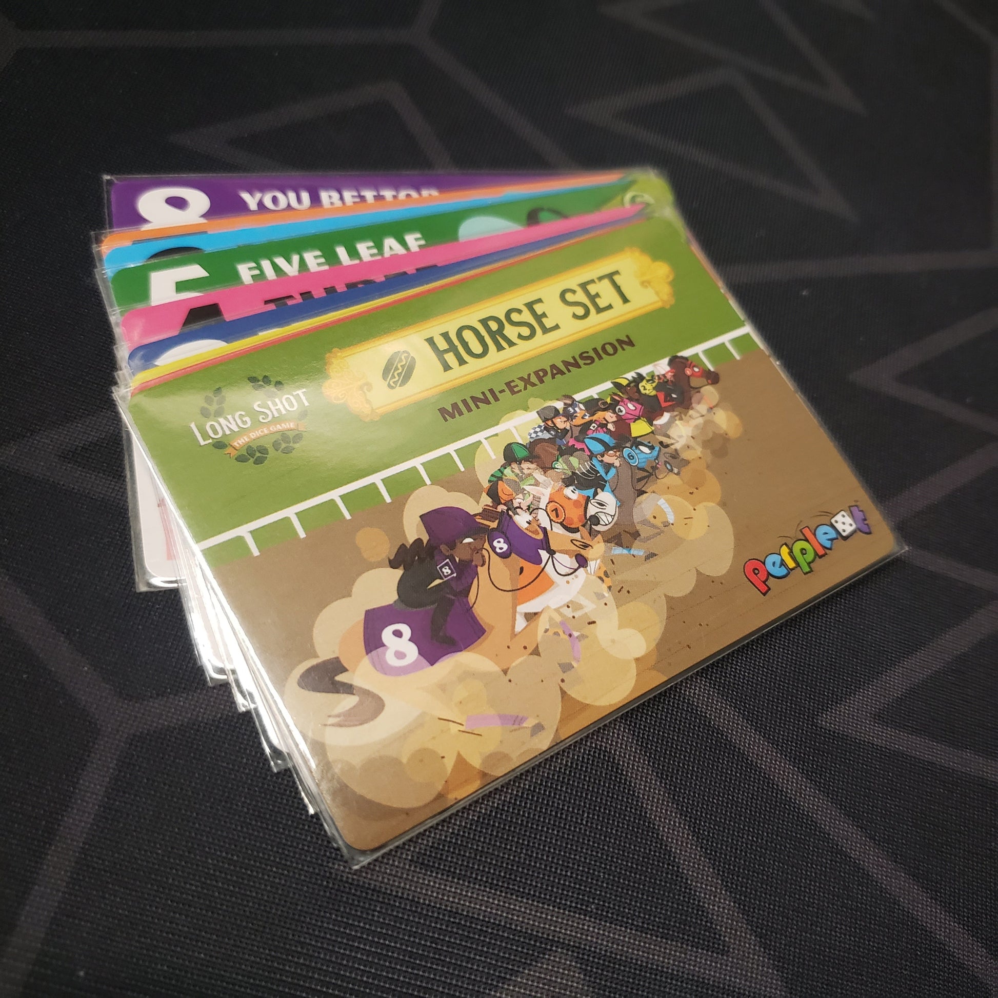 Image shows the fanned-out cards of the Horse Set 5 (Hot Dog) Mini expansion for the board game Long Shot: The Dice Game