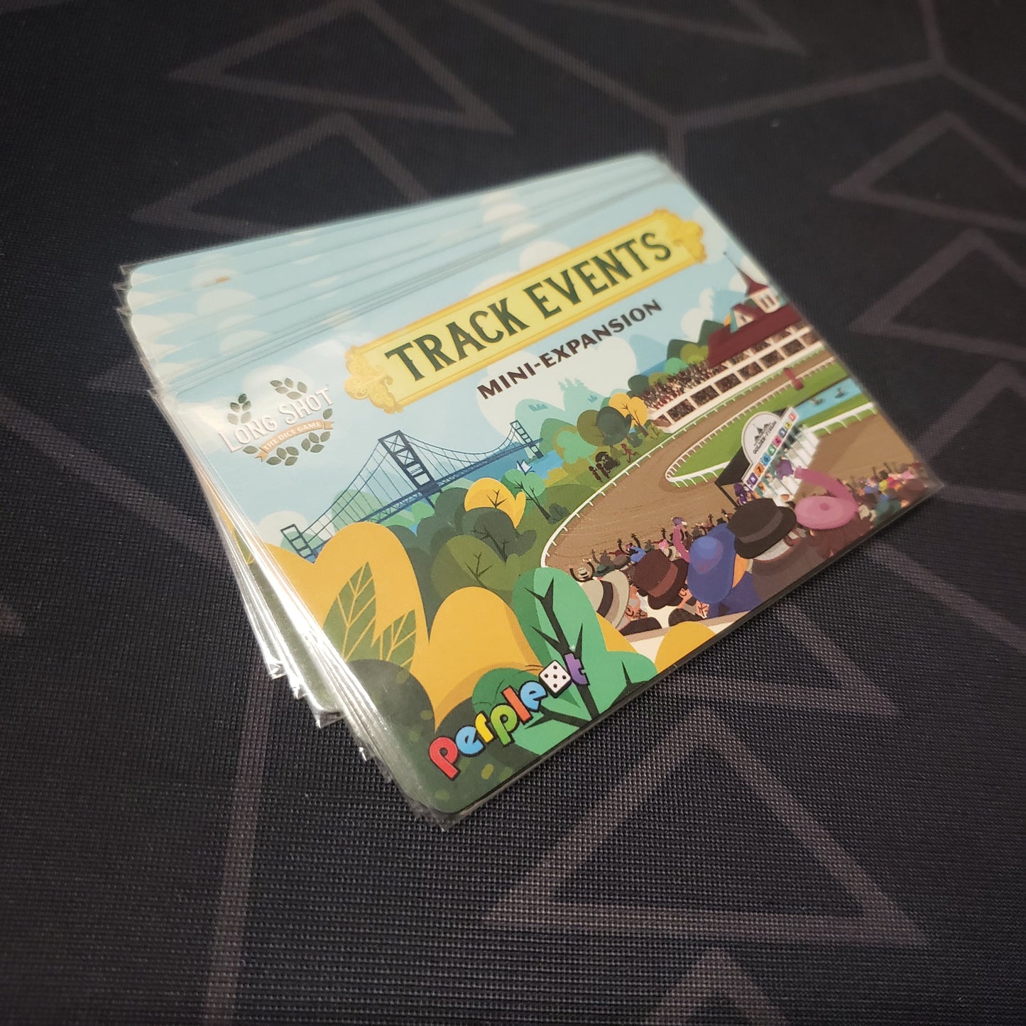 Image shows the fanned-out cards of the Track Events Mini expansion for the board game Long Shot: The Dice Game