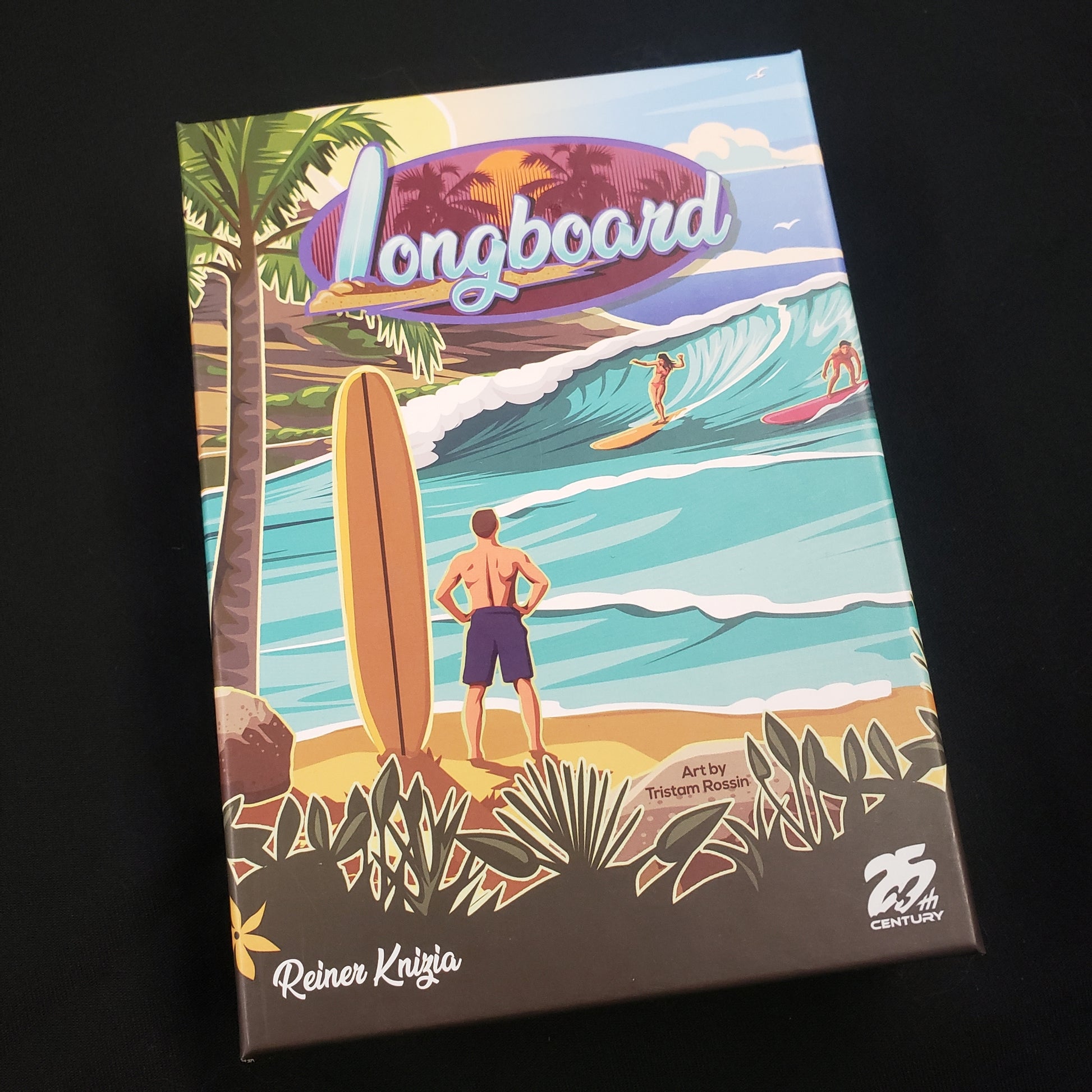 Image shows the front cover of the box of the Longboard card game
