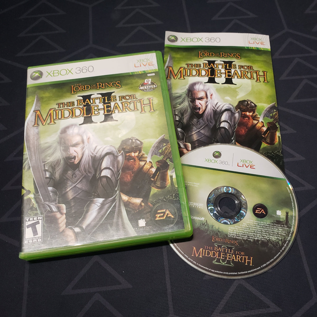Image shows the case, manual and disc for the video game Lord of the Rings: The Battle for Middle-Earth II for Xbox 360