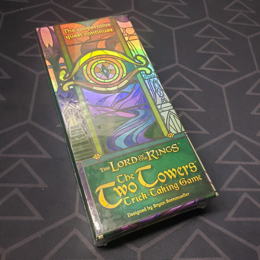 Image shows the front cover of the box for the card game Lord of the Rings: The Two Towers Trick-Taking Game
