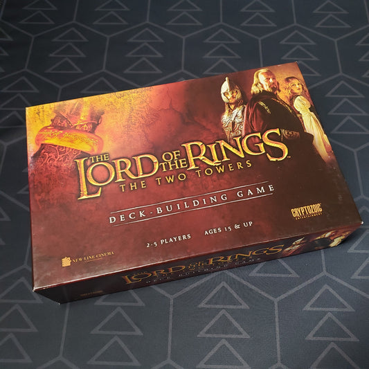 Image shows the front cover of the box of the Lord of the Rings: Two Towers Deckbuilding Game