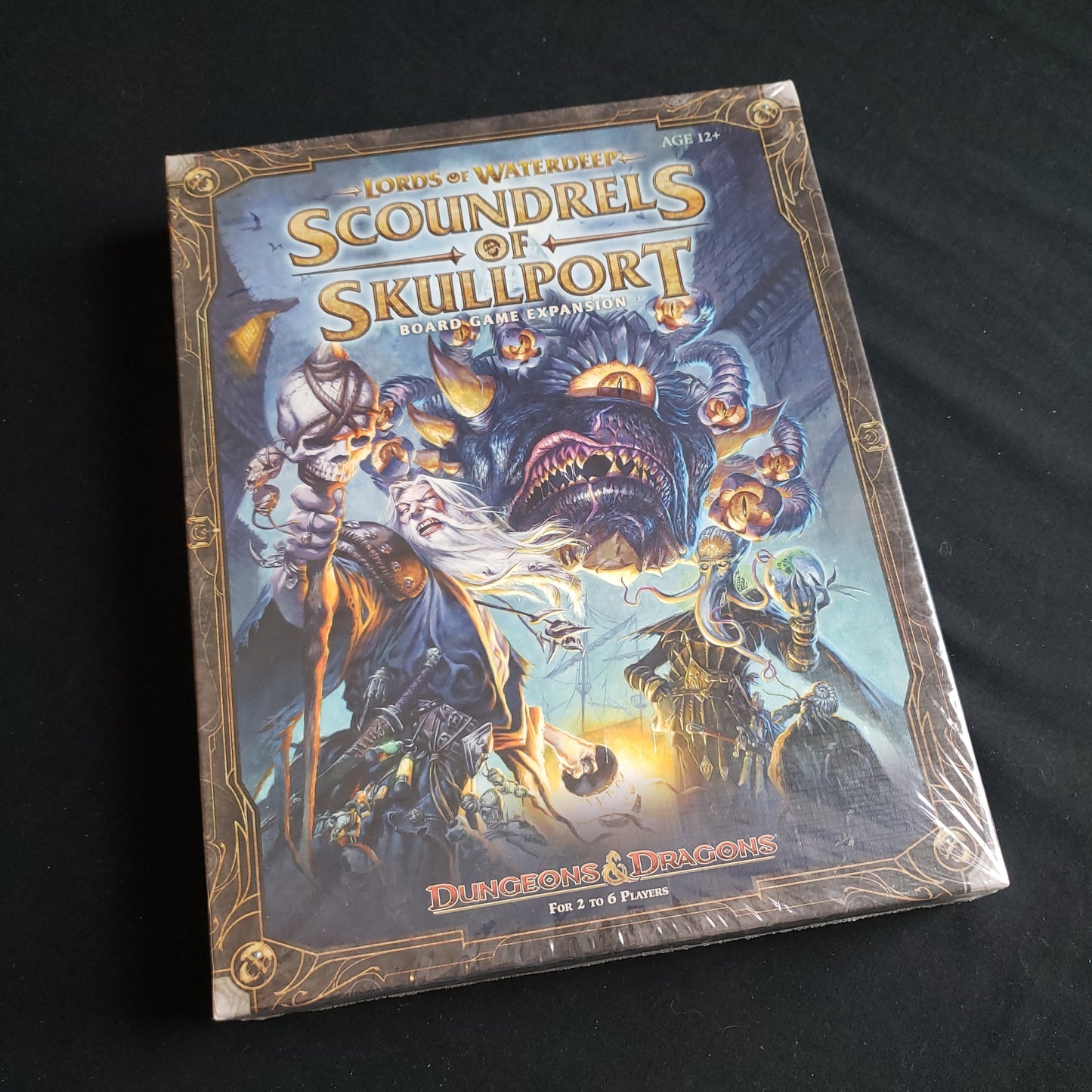 Image shows the front cover of the box of the Scoundrels of Skullport expansion for the Lords of Waterdeep board game