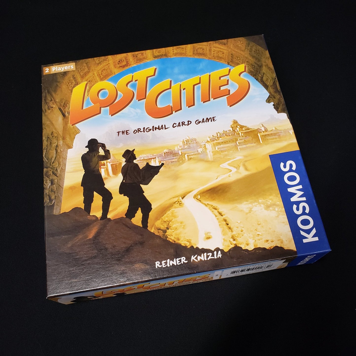 Image shows the front cover of the box of the Lost Cities card game