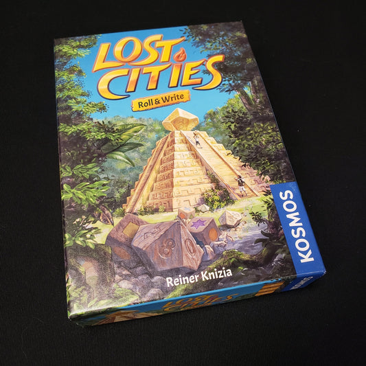 Image shows the front cover of the box of the board game Lost Cities: Roll & Write