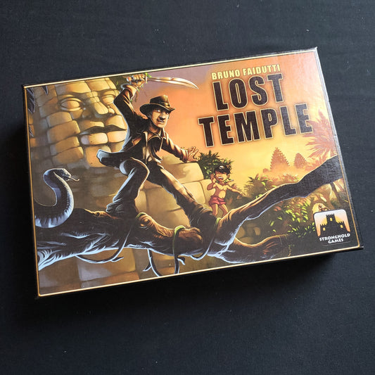 Image shows the front cover of the box of the Lost Temple board game