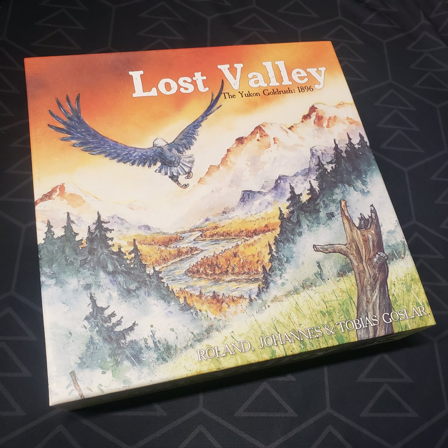 Image shows the front cover of the box for the Lost Valley: The Yukon Goldrush 1896 board game