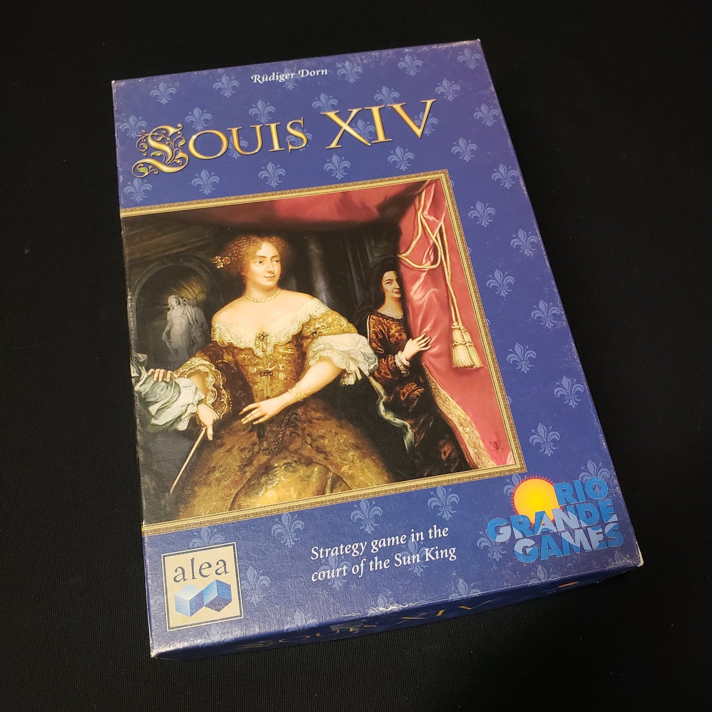 Image shows the front cover of the box of the Louis XIV board game