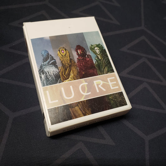 Image shows the front cover of the box for the LUCRE card game