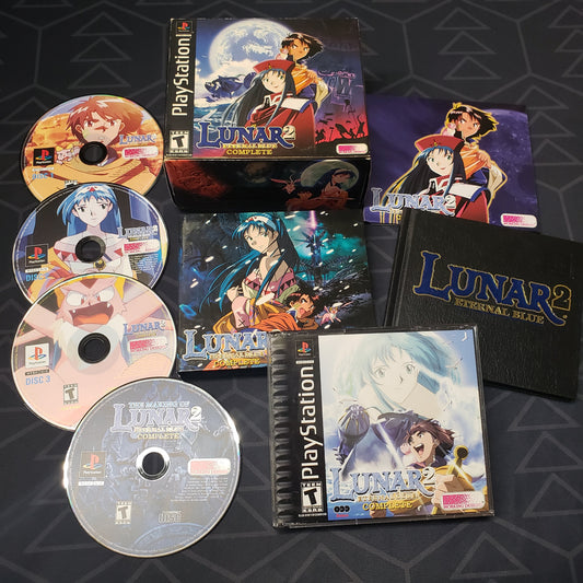Image shows the packaging, extras and four discs for the video game Lunar 2: Eternal Blue Complete for Playstation 1