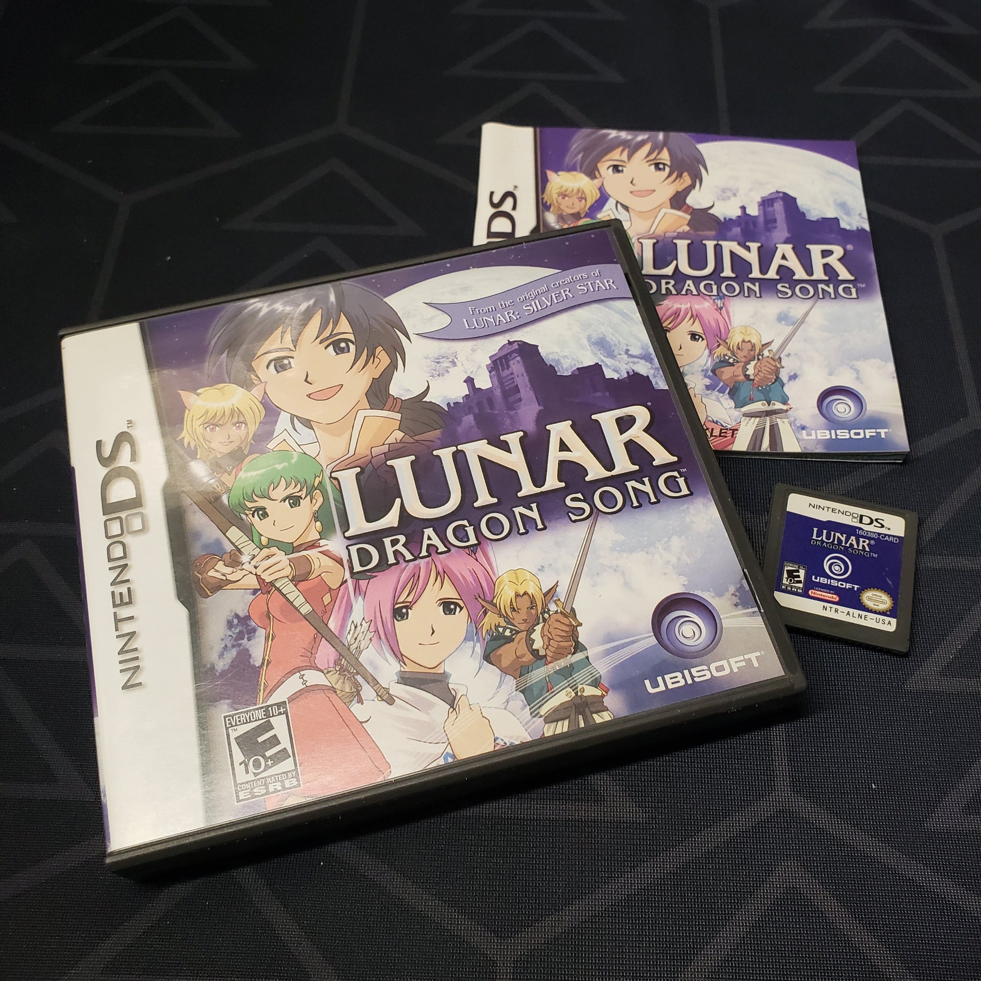 Image shows the case, manual and cartridge for the video game Lunar: Dragon Song for Nintendo DS