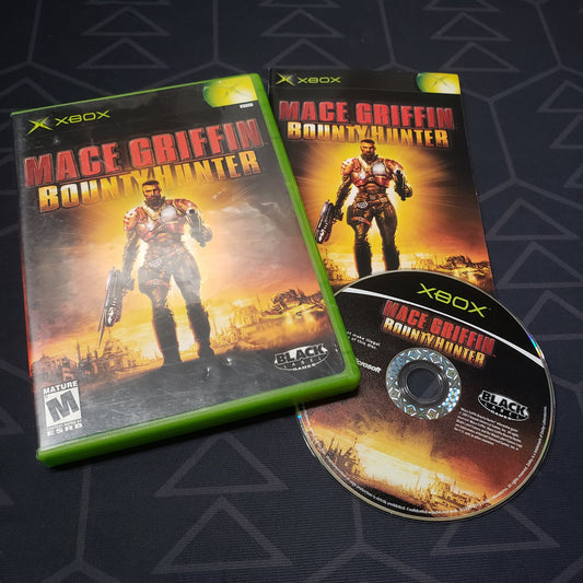 Image shows the case, manual and disc for the video game Mace Griffin: Bounty Hunter for the original Xbox