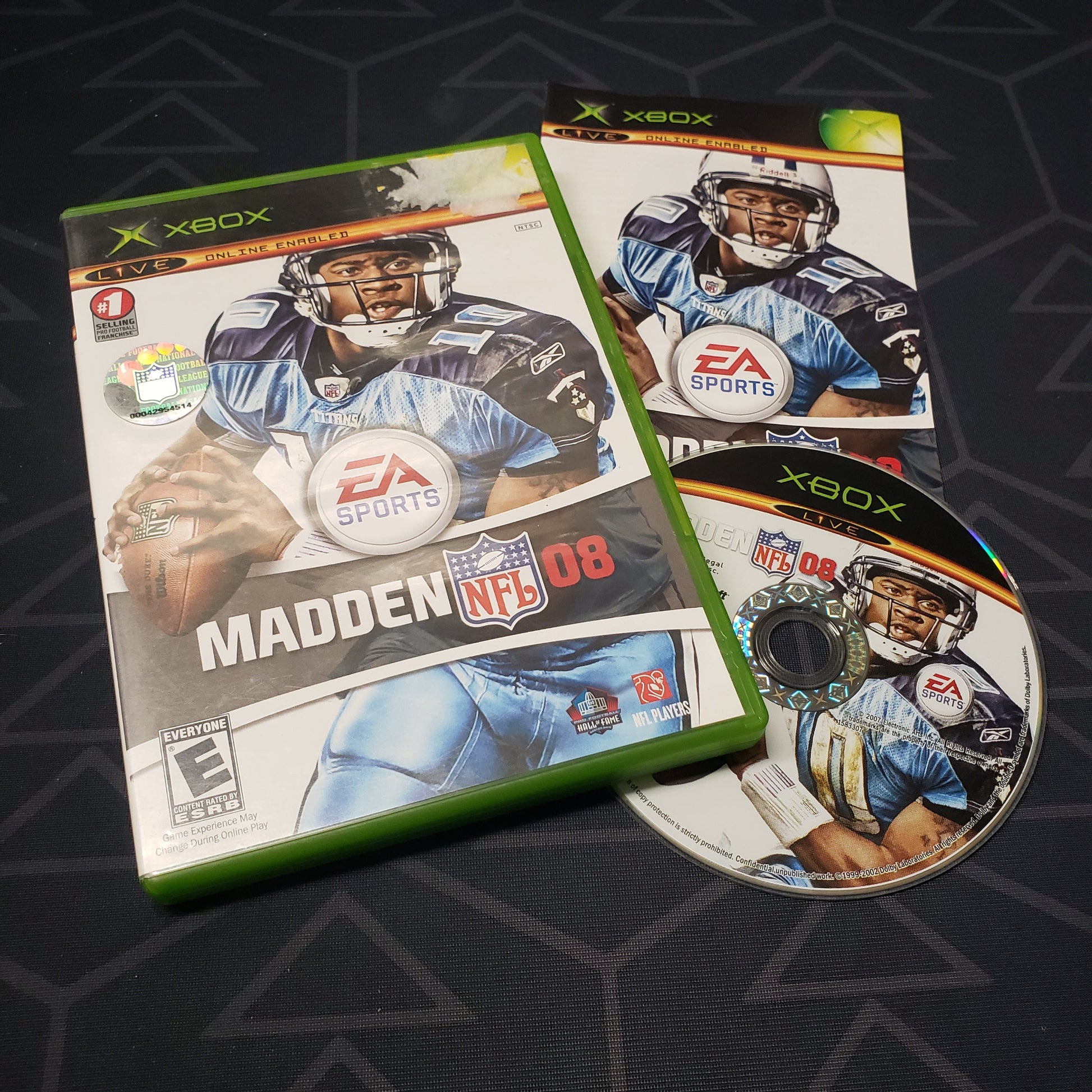 Image shows the case, manual and disc for the video game Madden NFL 08 for the original Xbox