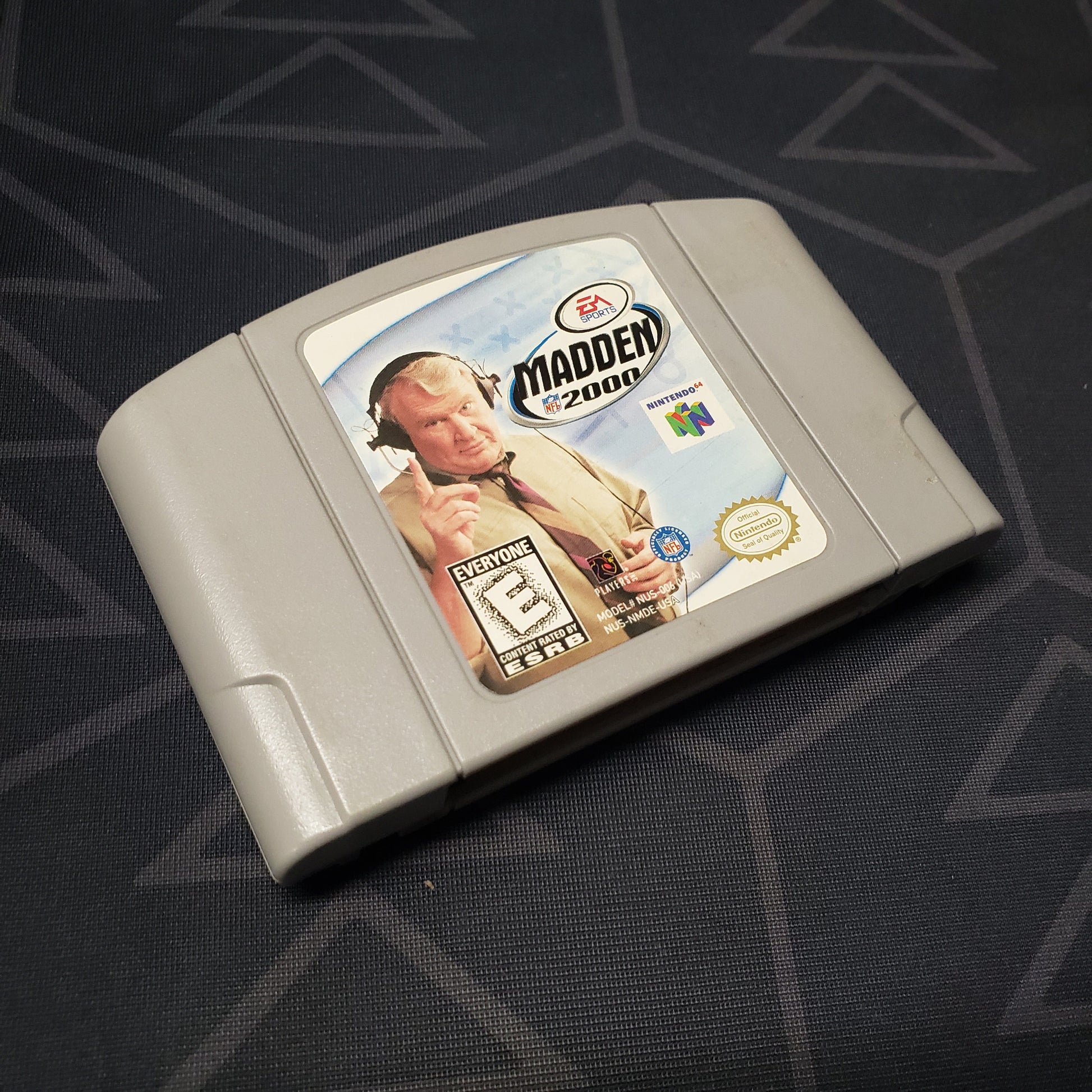 Image shows the front of the cartridge for the video game Madden NFL 2000 for the Nintendo 64