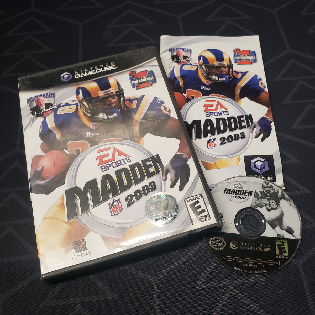 Image shows the case, manual and disc for the video game Madden NFL 2003 for Nintendo GameCube