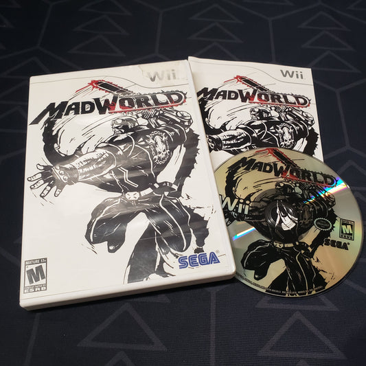 Image shows the case, manual and disc for the video game MadWorld for Nintendo Wii