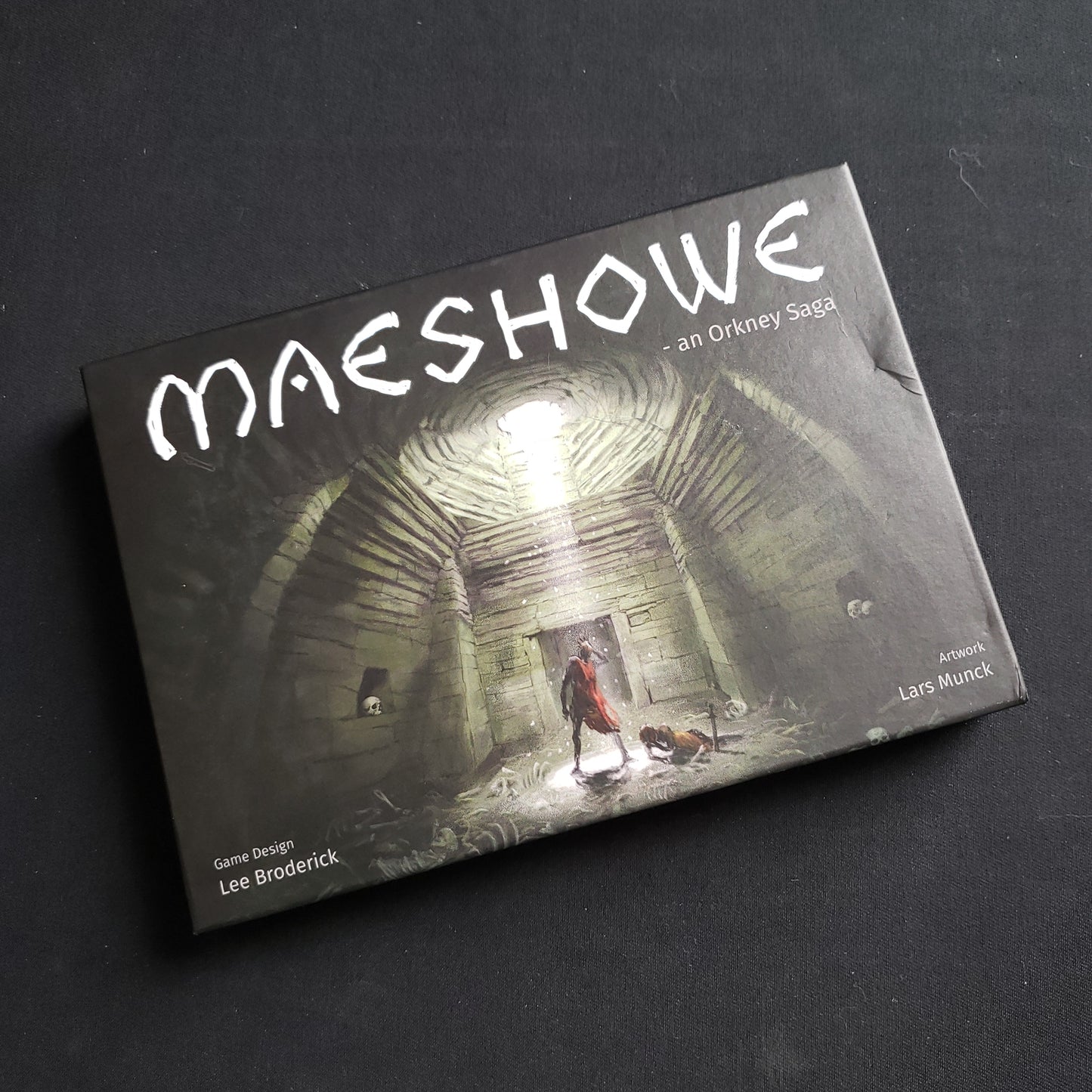 Image shows the front cover of the box of the Maeshowe: An Orkney Saga card game