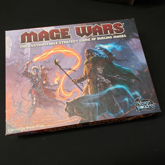 Image shows the front cover of the box for the Mage Wars board game