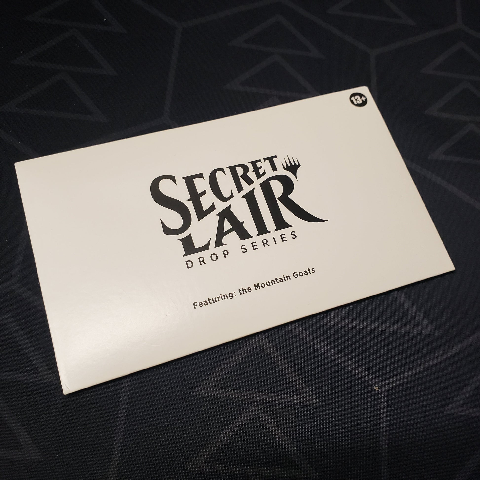 Image shows the front of the packaging for the Magic: Secret Lair Drop Series - The Mountain Goats set