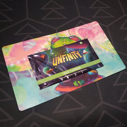 Image shows the front of the packaging of an Unfinity: Box Topper Pack for the card game Magic the Gathering still mounted on its backer cardboard