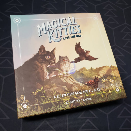 Image shows the front cover of the Deluxe core rules Boxed Set box for the roleplaying game Magical Kitties Save the Day!