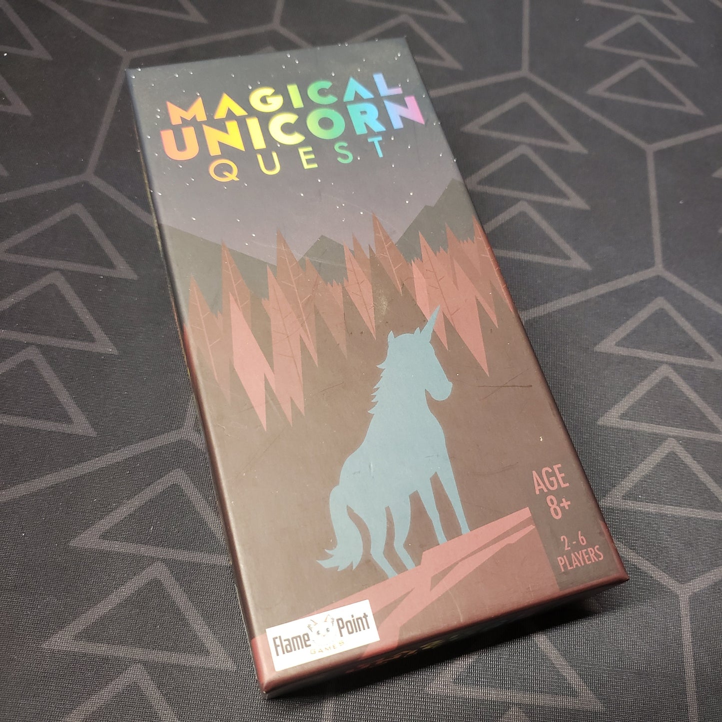 Image shows the front cover of the box for the Magical Unicorn Quest card game