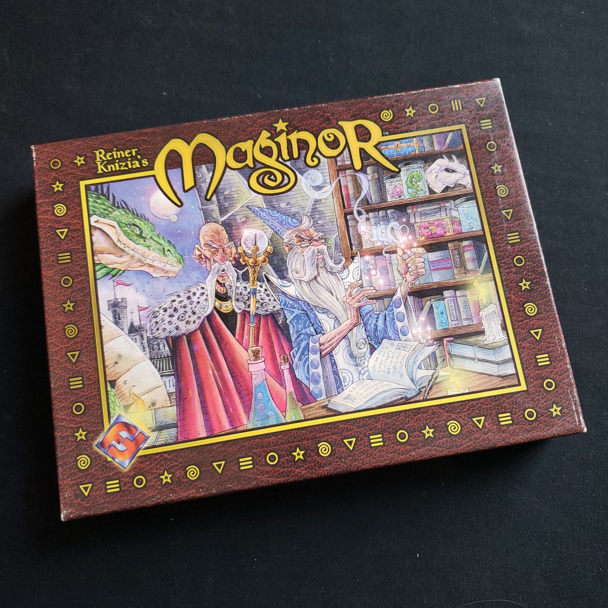 Image shows the front cover of the box of the Maginor board game