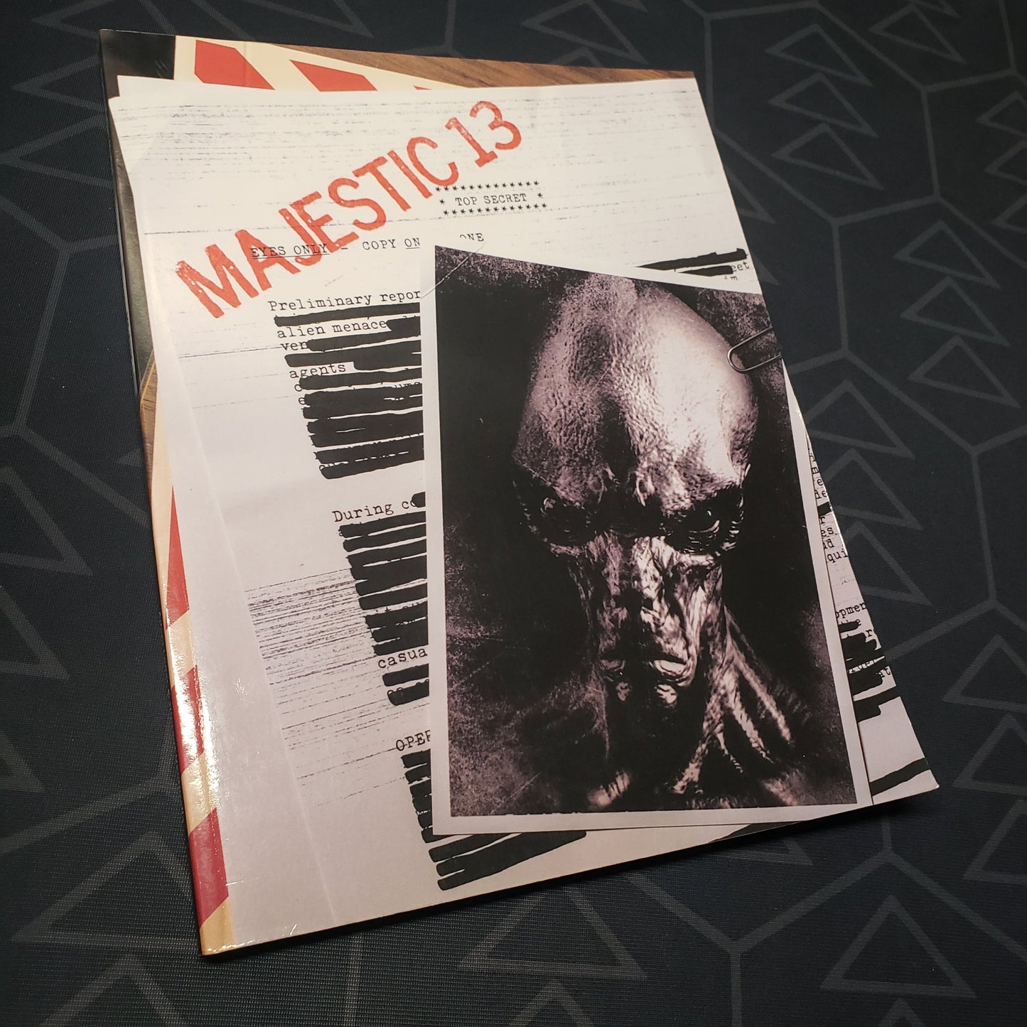 Image shows the front cover of the Majestic 13 wargaming book