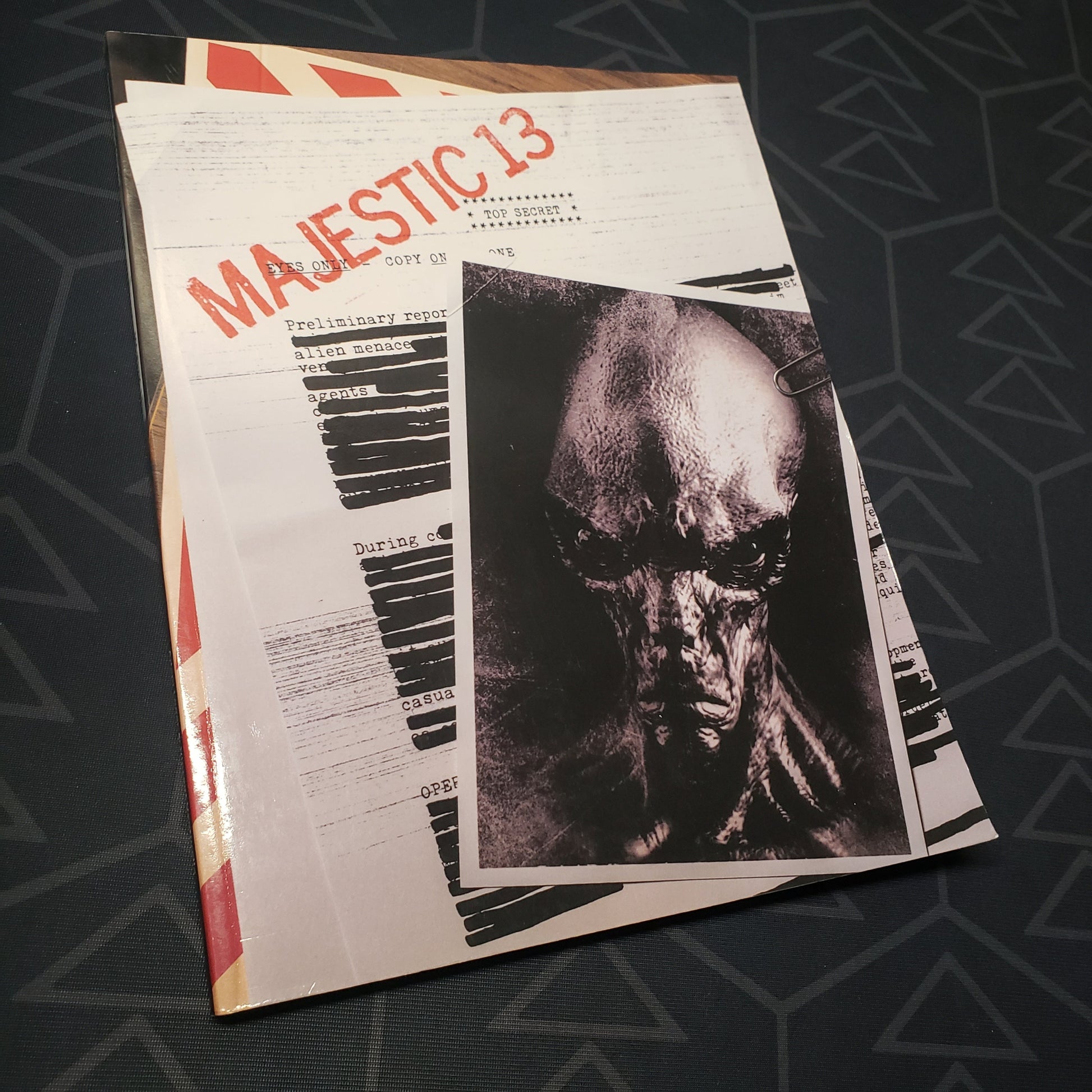Image shows the front cover of the Majestic 13 wargaming book