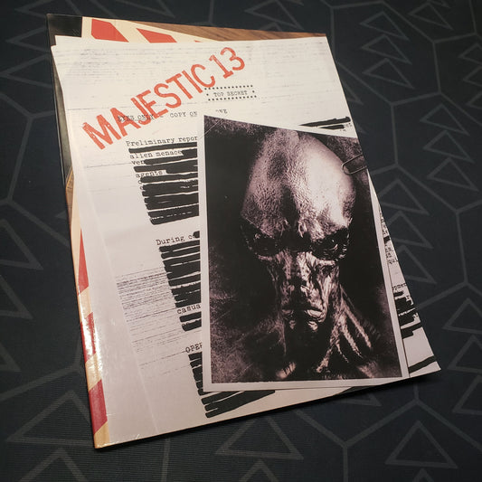 Image shows the front cover of the Majestic 13 wargaming book
