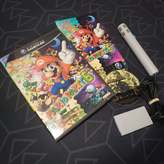 Image shows the case, manual, microphone and disc for the video game Mario Party 6 for Nintendo GameCube