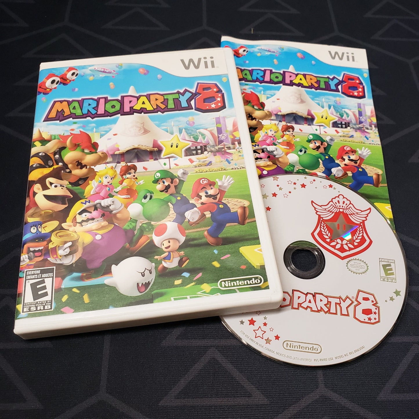 Image shows the case, manual & disc for the video game Mario Party 8 for Nintendo Wii