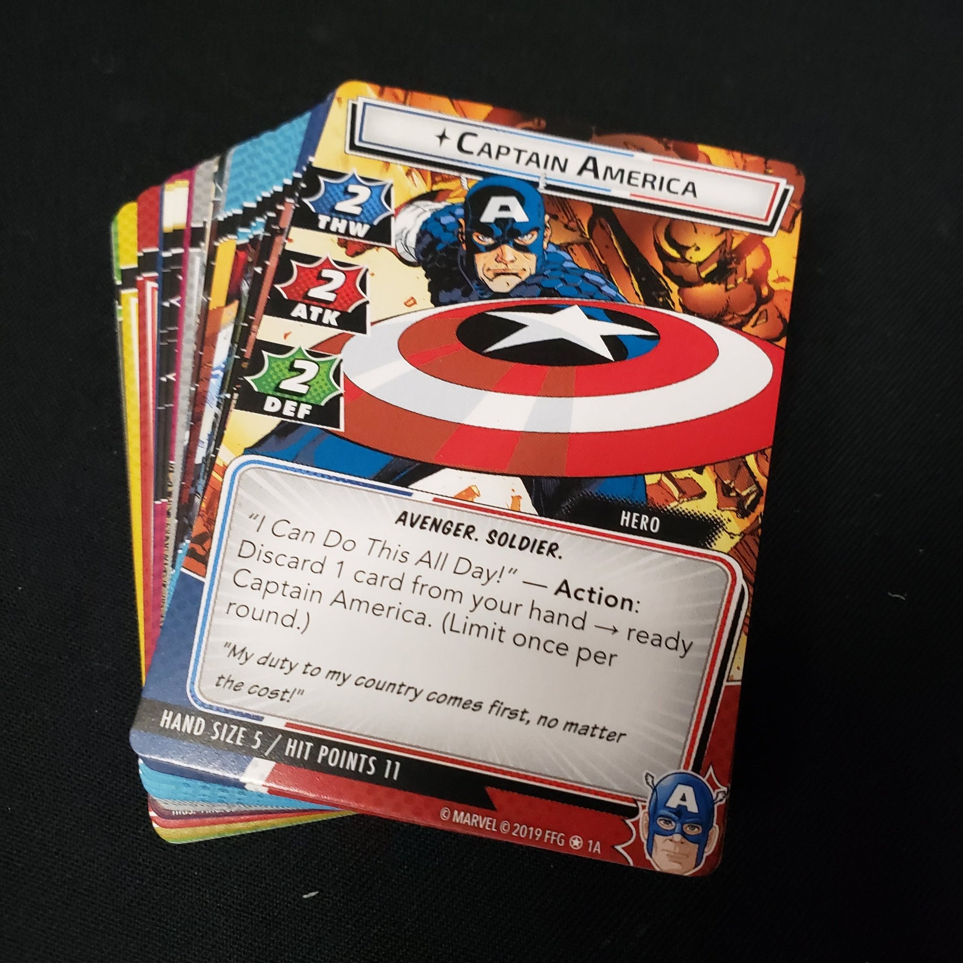 Image shows the cards fanned-out in a stack for the Captain America Hero Pack from the Marvel Champions card game