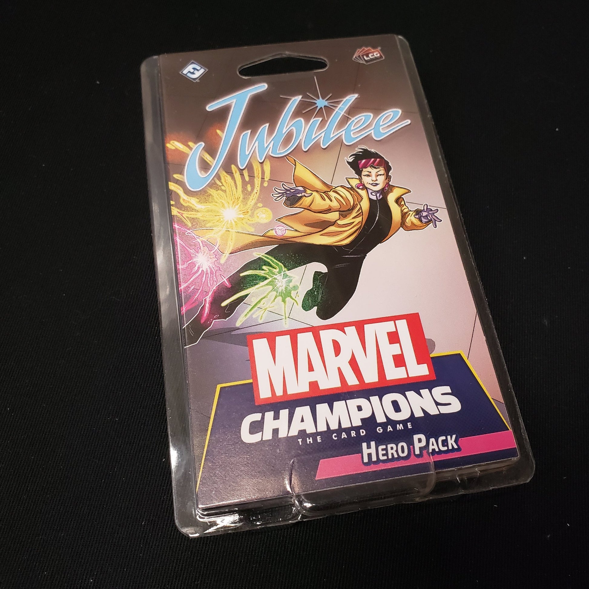 Image shows the front of the package for the Jubilee Hero Pack for the Marvel Champions card game