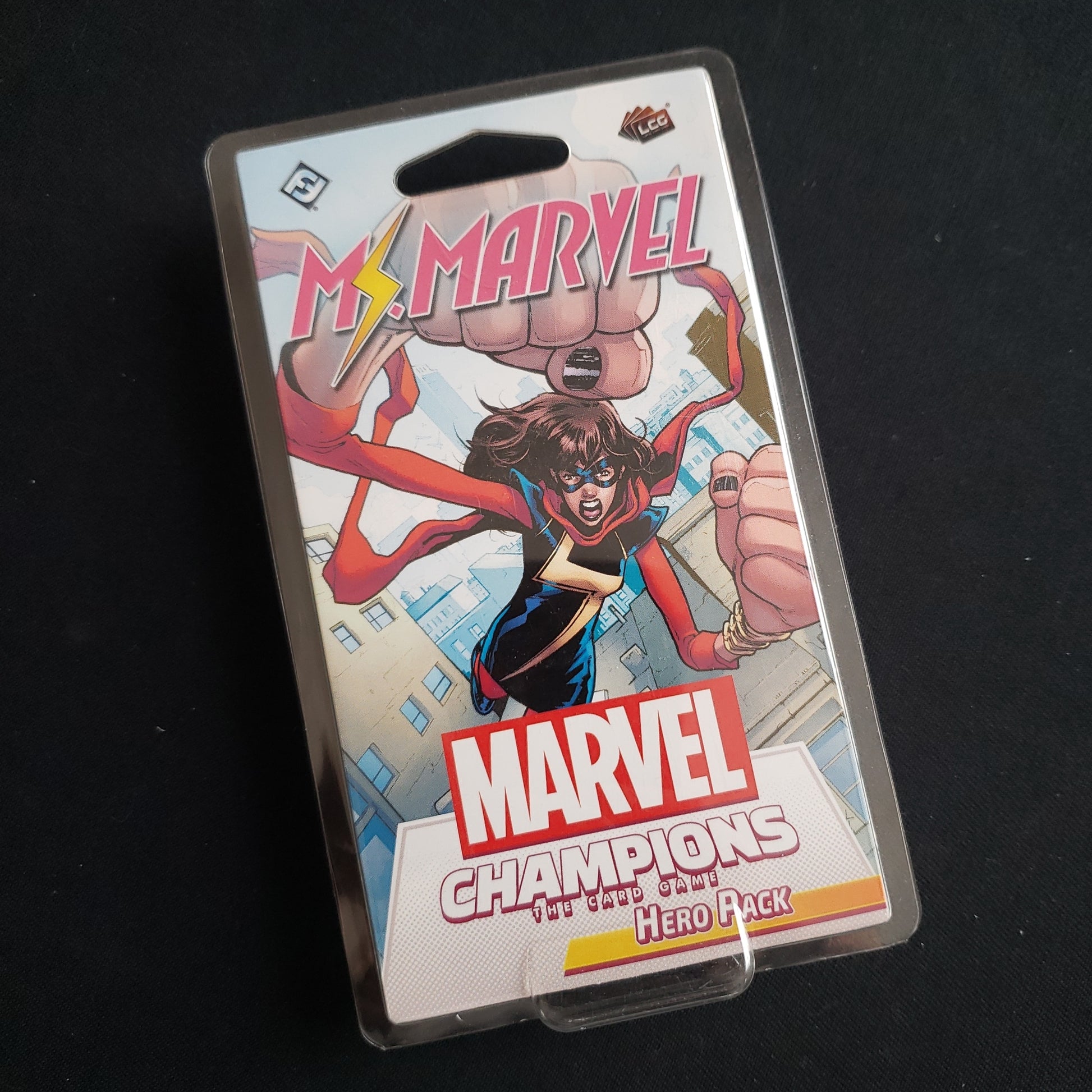 Image shows the front of the package for the Ms. Marvel Hero Pack for the Marvel Champions card game