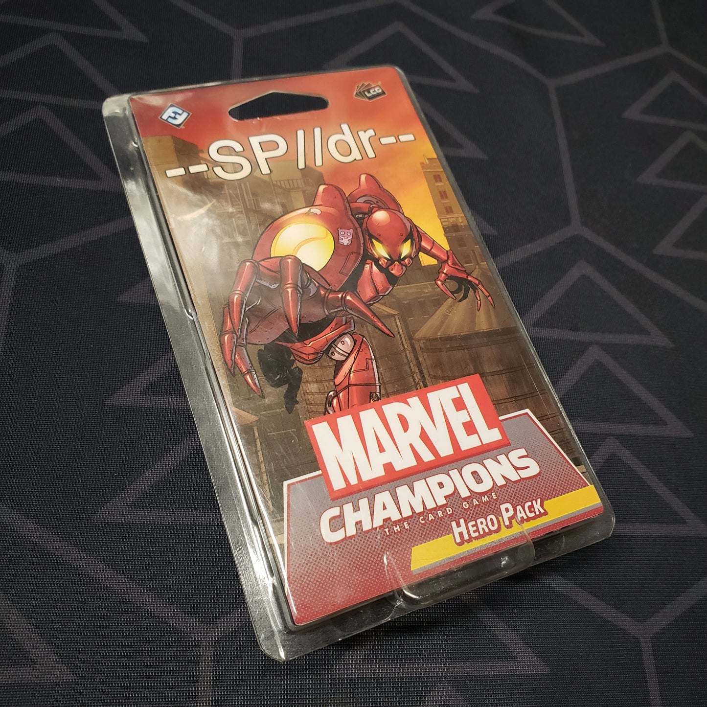 Image shows the front of the package for the SP//dr Hero Pack for the Marvel Champions card game