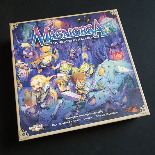 Image shows the front cover of the box of the Masmorra: Dungeons of Arcadia board game