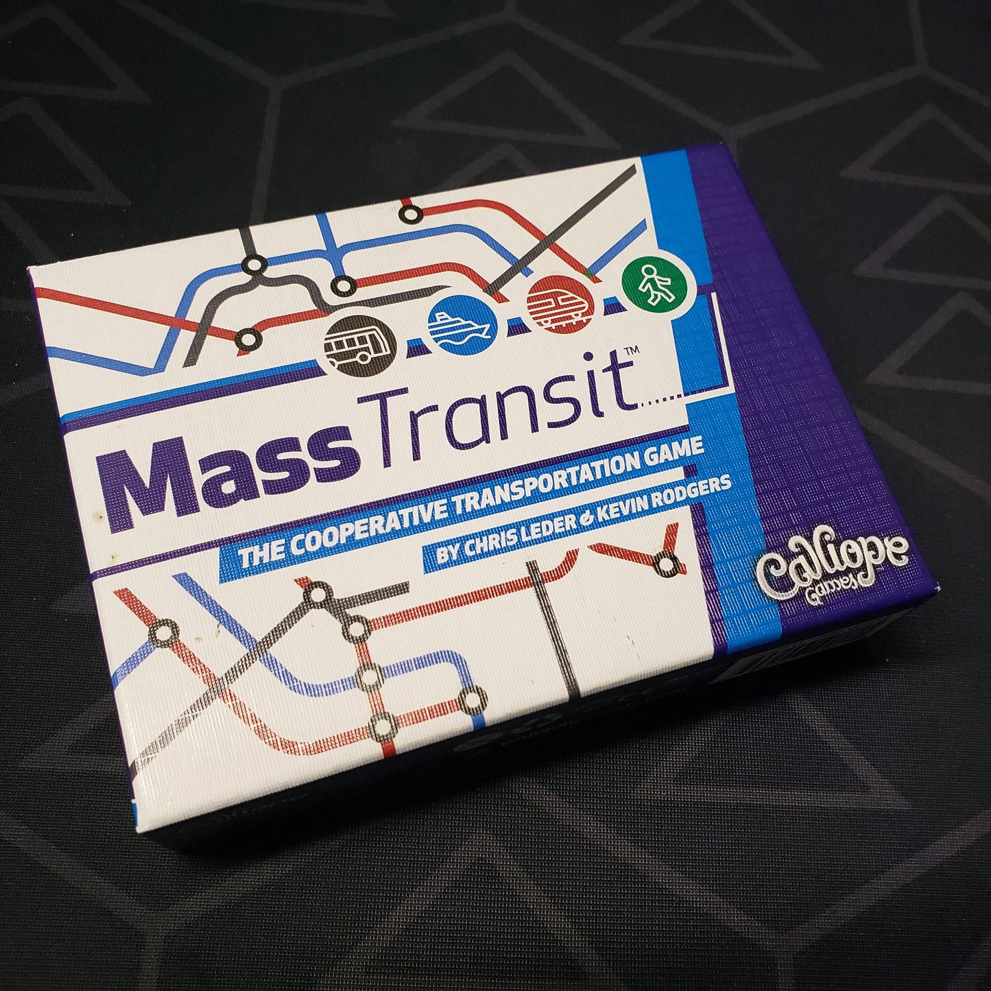 Image shows the front cover of the box for the Mass Transit card game